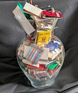 lot 1044 image: Collection of Vintage Matchbooks in Glass Vase