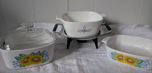 lot 2026 image: Corning Ware Sunflower Pattern Casserole Set with Warming Stand