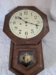 lot 2548 image: DuPont Hamilton Octagonal Wall Clock - 24 in&nbsp