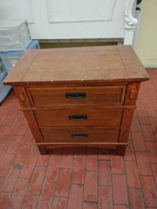 lot 1010 image: Medium Brown Three Drawer Night Stand - Signature Design by Ashley Furniture - Retail $317