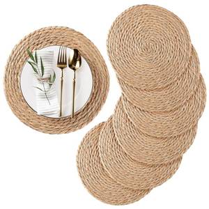 lot 15738 image: Round Woven Placemats Set of 6, Natural Water Hyacinth Place mats, 12 inch Rattan Placemats Wicker Placemats Farmhouse Boho Braided Heat Resistant Outdoor Placemat Patio Table Place Mats - Retail $20