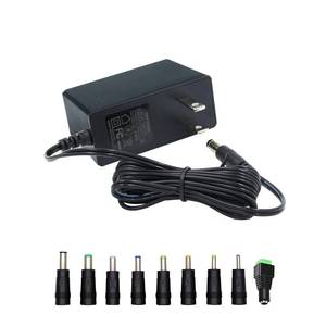 lot 15849 image: 12V Power Supply, 12V 2A 24W Power Supply AC100-240V to DC 12 Volt Adapter with 5.5mm x 2.1mm Tip and 9 Interchangeable Jacks Plug for LED Strip Lights, CCTV Cameras, Routers and More - Retail $10