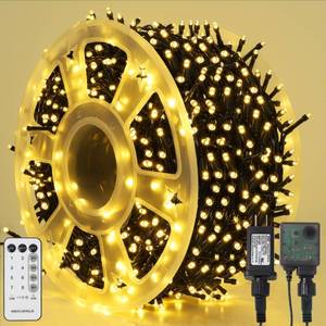 lot 15949 image: 1000LED Christmas Lights, Extra Long 328FT Xmas Green Wire Fairy String Lights Plug in Outdoor, Remote Control & 8 Lighting Modes, Waterproof for Wedding Party Bedroom Decorations, Warm White - Retail $33