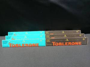 lot 3751 image: 6 Pack of Toblerone Chocolate Bars Variety Dark Chocolate with Honey and Almond Nougat and Milk Chocolate with Salted Caramelized Almonds and Honey and Almond Nougat