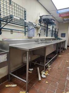lot 19361 image: Commercial 19ft Stainless Steel 3-Compartment Sink with Wall Shelving
