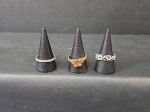 lot 227 image: Silver and Clear Stone Band (Non-Magnetic), Gold Toned Ring (Magnetic), and Silver Wide Band (Non-Magnetic)