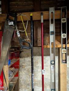 lot 2412 image: Construction Tool Collection - Levels, Saws and Poles