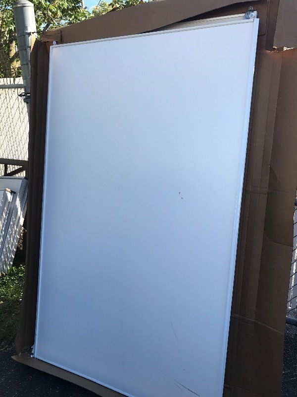 lot 9187 image: New sliding door panel 78 inches tall by 48 inches wide made of lightweight metal with white  Wood grain finish