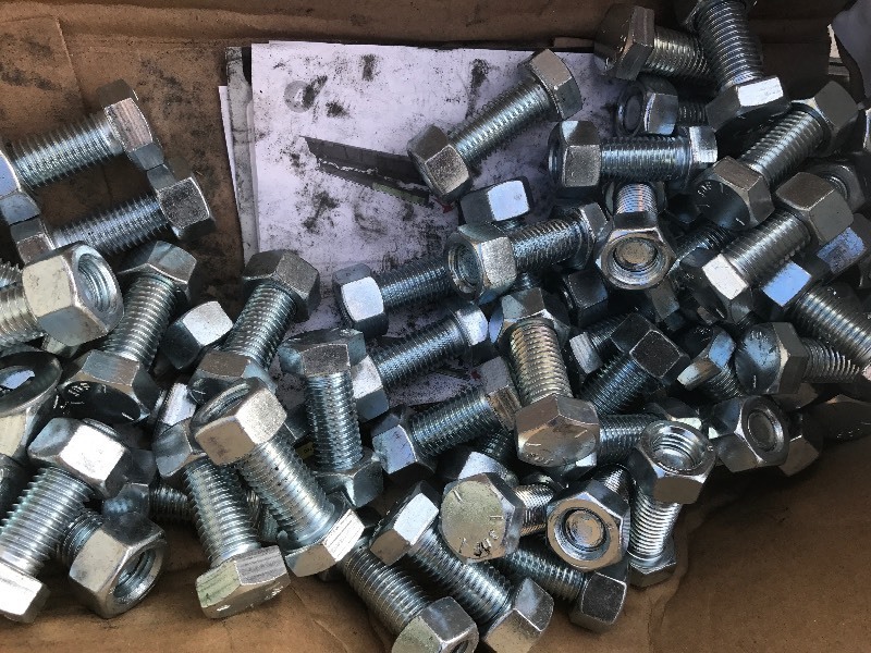 lot 9591 image: Large Lot of half-inch bolts with net as pictured