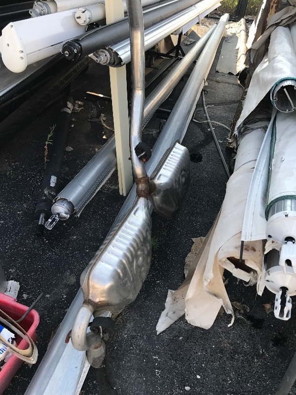 lot 804 image: A Nother muffler system from engine to tail pipe includes three built-in mufflers as pictured