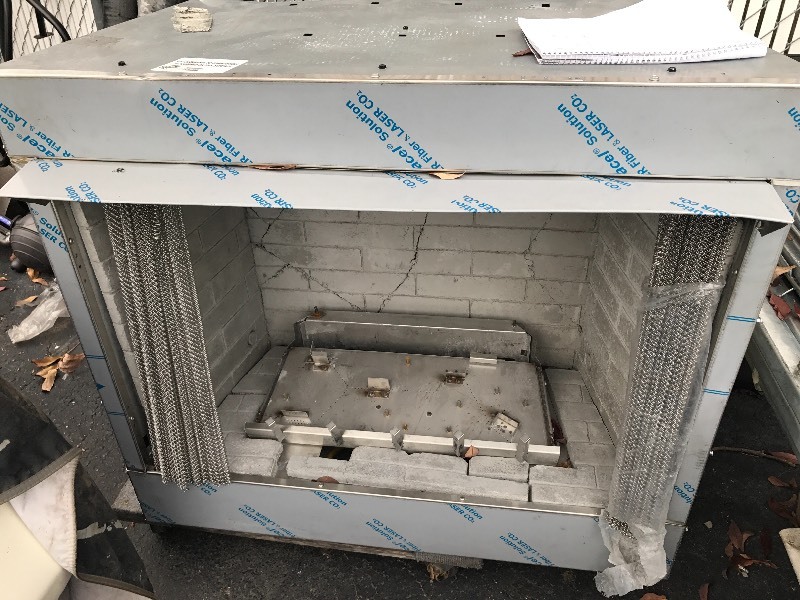 lot 862 image: Stainless steel front gas fireplace as picture comes with decorative logs high dollar item