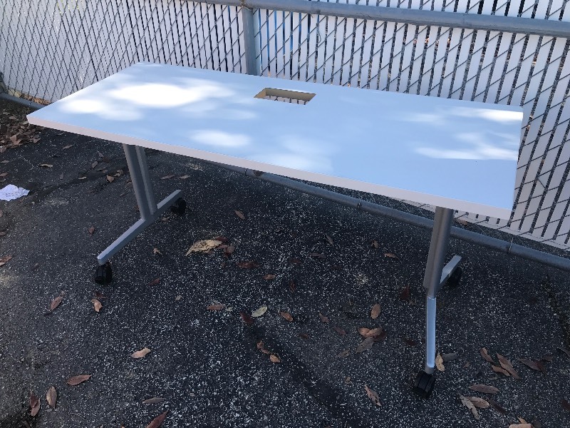 lot 9629 image: New double training table on casters tilt top as pictured yours will come in a box for easy transport