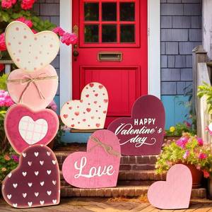 lot 25985 image: Giant Wooden Porch Yard Decorations, 37 Heart Outdoor Signs with Stands, Decor for Front Door, Garden, Farmhouse, Valentines Day Anniversary.  - Retail $35