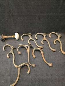 lot 1110 image: Early 1900s Cast Iron Coat Hooks and door knob Collection