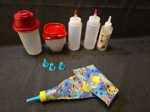lot 1145 image: Wilton Decorating Bottle Set with Minion Print