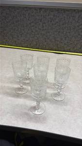 lot 1043 image: Crystal Cordial Glasses with Floral Design - Set of 7. (Manganese Glow)