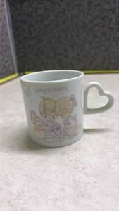 lot 1064 image: Precious Moments Loving is Sharing Coffee Mug