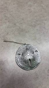 lot 1114 image: Silver Sand Dollar Ornament with Textured Design. (SSGrandma)