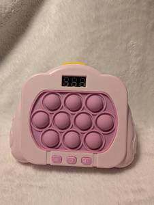 lot 2135 image: Pink Pop Push Bubble Fidget Game