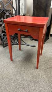 lot 101 image: Red wooden old sewing cabinet turned table 30 x 22 x 16 in