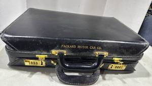 lot 1093 image: Leather briefcase and tragus laptop sleeve