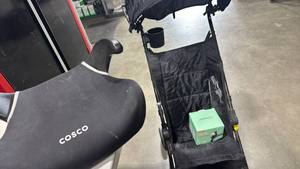 lot 1121 image: Kolcraft stroller with accessories and Cosco booster seat