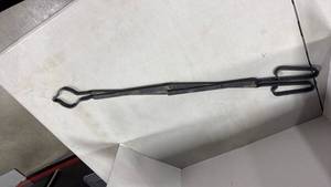 lot 1142 image: iron fireplace tongs used for handling firewood