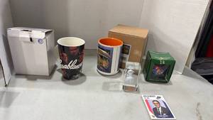 lot 2037 image: Kansas Jayhawks ornament, Coach card, coffee mugs and more