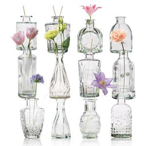 lot 1726 image: Yabool 12 Pcs Bud Vase Set, Vases for Centerpieces, Cute Glass Bud Vases in Bulk, Small Vases for Flowers, Mini Vase Set for Wedding Decorations, Home Table Flower D�cor