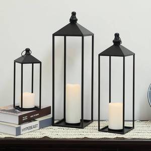 lot 1175 image: DECORKEY LED Lanterns Decorative Indoor&Outdoor, 23���� 19���� 13���� Large Black Candle Lanterns Set with 3 Flameless Candles, Metal Holders for Porch, Patio, Garden, Home, Fireplace, Decorations Decor - Retail $60