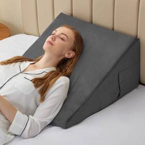 lot 1257 image: Bedluxe Wedge Pillow, 9 inch Bed Wedge Pillow for Headboard, Triangle, Plush Grey - Retail $45