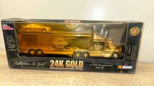 lot 43 image: NASCAR Tabasco 24K Gold Plated Transporter with Stock Car New old stock - Retail $45