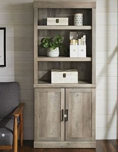 lot 6069 image: Better Homes & Gardens Glendale 5 Shelf Bookcase with Doors, Rustic Gray Finish - Retail $102