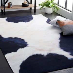 lot 15372 image: Black and White Cowhide Area Rug