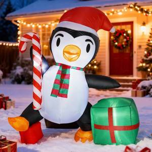 lot 7269 image: 6 FT Christmas Inflatable Penguin with Candy Cane