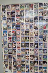 lot 206 image: TOM SEAVER SERIES I RUN 1-1992 Pacific Tom Seaver Tom Terrific Uncut sheet showing 111 Cards front & back. HAS SOME DAMAGE