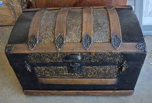 lot 247 image: Victorian Steamer Trunk with Ornate Floral Metal Work and Wood Trim.  Bottom needs replaced.  Hand-inscribed markings visible on interior lid.