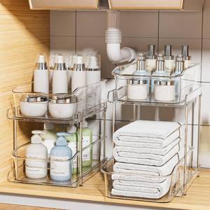 lot 44668 image: 2-Tier Under Sink Organizers and Storage, Multi-Purpose Stackable Bathroom Cabinet organizers, Pull Out Kitchen Pantry Organization and Storage with Dividers(2 Pack, Clear) - Retail $40