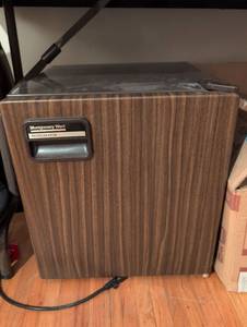 lot 252 image: Montgomery Ward Compact Refrigerator with Wood Grain Finish