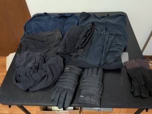 lot 388 image: Two pairs of gloves and cut off sleeve shirts
