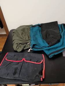 lot 389 image: One large teal bag military duffel bag and another bag