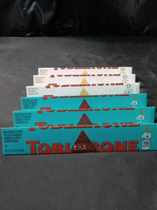 lot 4983 image: Toblerone Chocolate Bars 3 White chocolate 3 milk chocolate with Salted caramelized Almonds