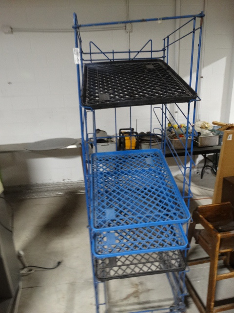 lot 6195 image: Bread rack on wheels.