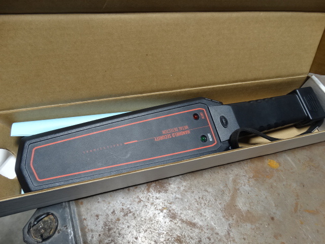lot 6203 image: Handheld security metal detector.