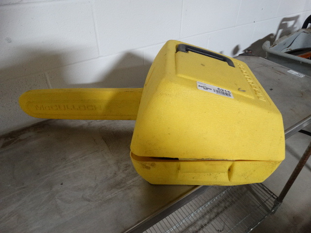 lot 6215 image: Mcculloch chain saw in case.