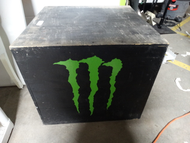 lot 6278 image: Wooden box with monster sticker.