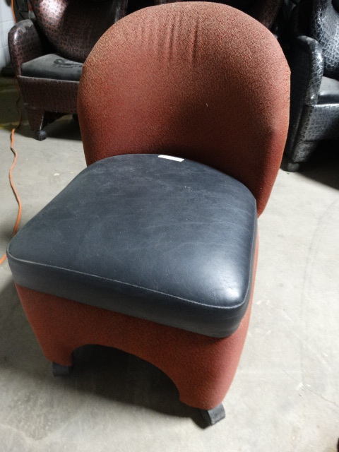 lot 6280 image: Little cushined red chair on wheels.
