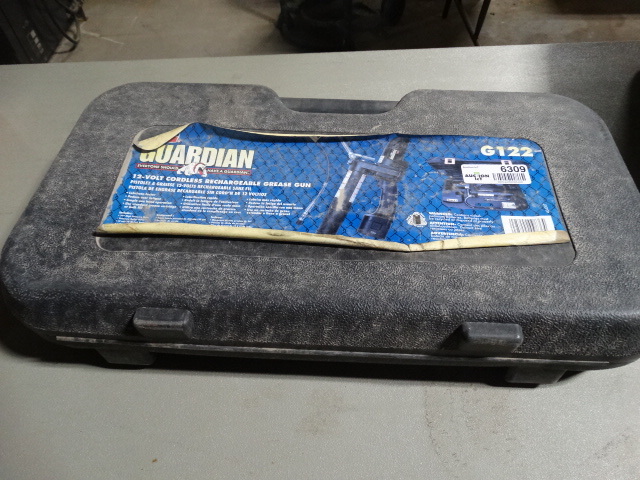 lot 6309 image: 12 Volt cordless rechargeable grease gun.