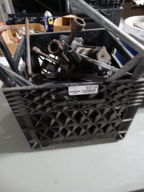 lot 6318 image: Lot of floor jacks and tire irons.