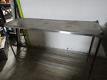 Stainless steel stand. 60'' x 18'' x 34''.